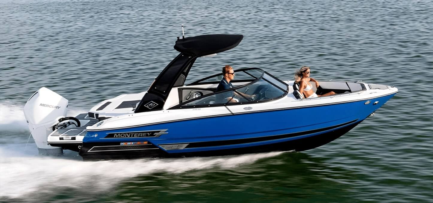 A couple on a Monterey boat - bought from Ultimate Marine - cruising on the water.